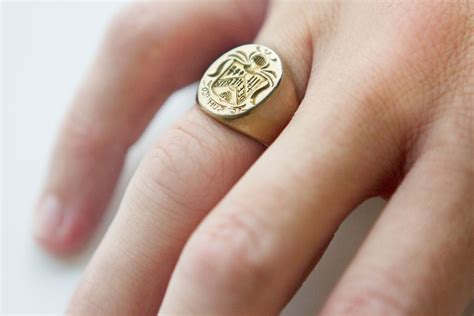 signet rings on fingers